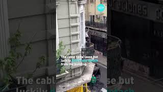 65-year-old woman in Argentina uses a cable to flee a blazing building in Buenos Aires