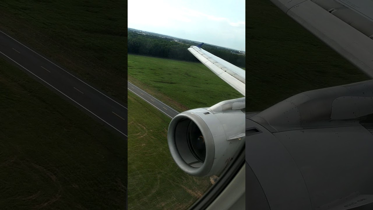 First class window seat landing at an unknown airport