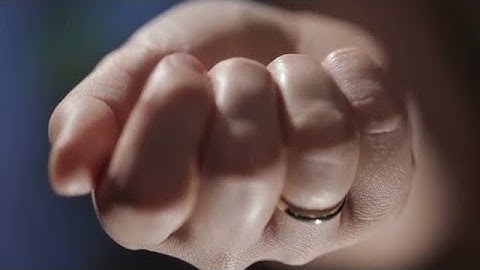 Hand With A Key Unfolding Stock Video