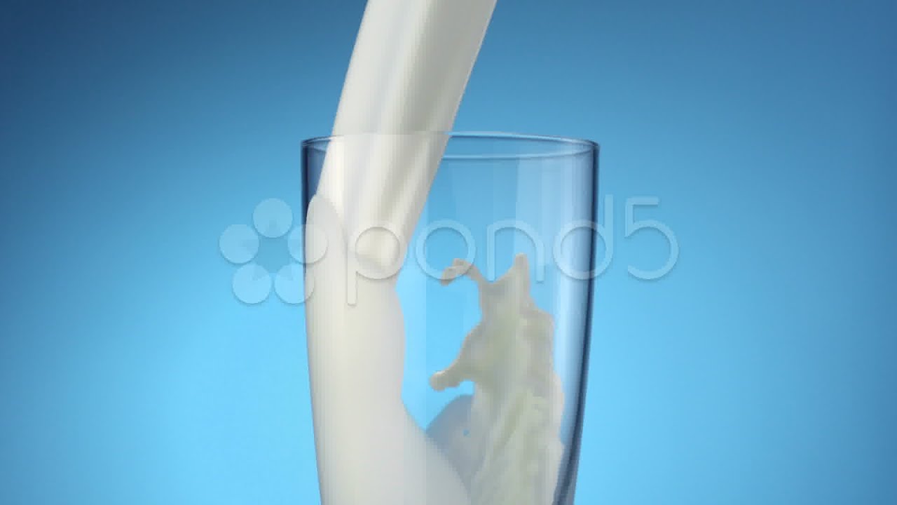Milk Pouring Into Glass, Slow Motion. Stock Footage