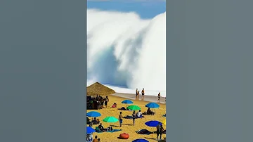 A Large Beach Wave Surprises Swimmers 