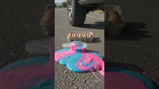 "Ultra-realistic 9:16 vertical video. Three products are arranged on a rough asphalt road:..