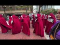 No Kings protesters wearing ‘Handmaid’s Tale’ costumes march in Fort Worth