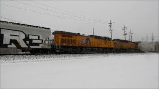 UP 8934 leads a manifest with UP 6630 and UP 6214 as mid DPU's in Geneva IL