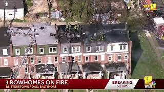 SkyTeam-11 is over several homes on fire on Reisterstown Road