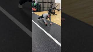 Straight arm plank with kb slide