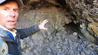 Geologist explores a lava tube (cave) at Craters of the Moon National Monument, Idaho