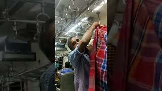 Towel seller in local train in Kolkata.