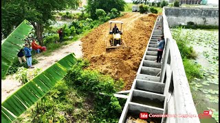 Land Filling Up Building Side Road By Komatsu D31A Dozer Pushing Dirt And Dump Trucks Unloading Dirt