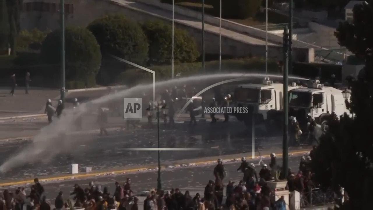Police use water cannon on rail disaster anniversary protesters in Athens