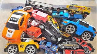 A box full of a mix of cars of all sizes