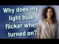 Why does my light bulb flicker when turned on?