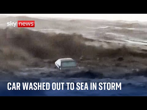 Greece flooding: car washed out to sea in violent storm
