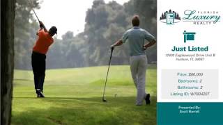 STUNNING CONDOMINIUM IN THE BEAUTIFUL BEACON WOODS GOLF COURSE COMMUNITY
