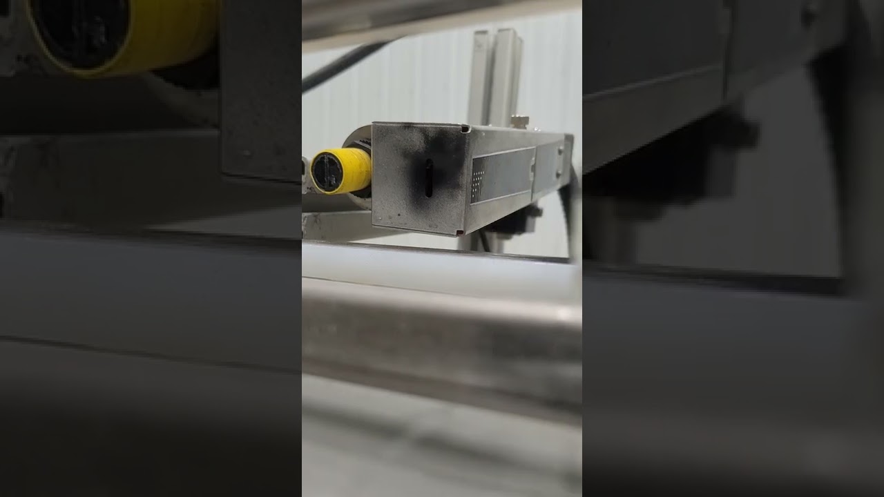 Hitachi Ink jet date coder printer on maple mini bottles