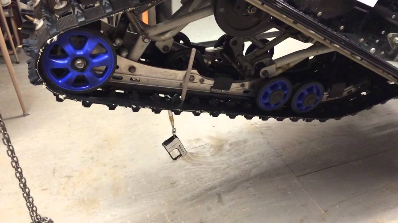 How to adjust track tension on a snowmobile - YouTube