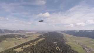 Solar Airship flying above mountains.