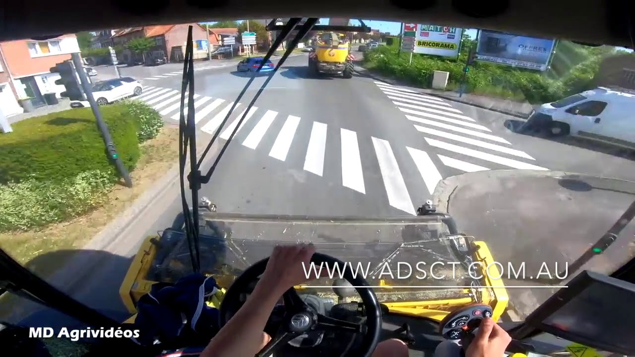 Driving combine on road with full speed