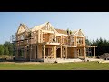 Transforming the idea into a modern wooden house using massive machinery.