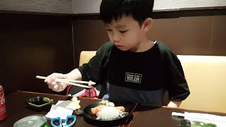 Lucas using chopsticks