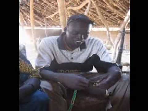 Peter Piol, Wunlang School teacher,  demonstrates a string abacus