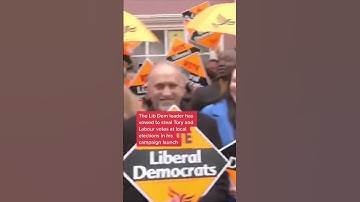 Lib Dem leader Sir Ed Davey arrives in a tractor to meet party supporters