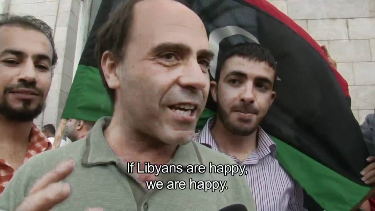 Film backdrop image for Libyans in Tunisia react to reports of Muammar Gaddafi's death (2011)