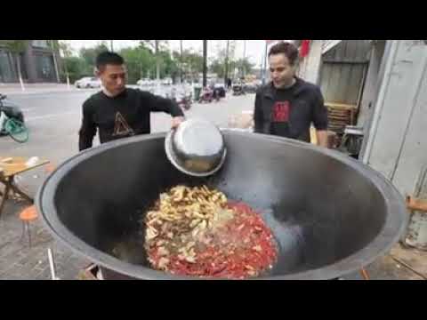 giant wok cooking Stock Photo