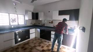 white and wooden finish Modular kitchen9526284034/staircase cupboard.kerala modularkitchen@interior