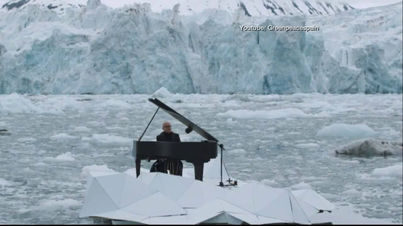 Man Plays Piano While Floating within the Arctic Ocean
