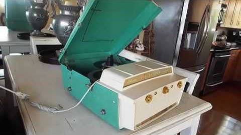 Silvertone Fiberglass case, automatic 4 speed record player playing a stack of 45