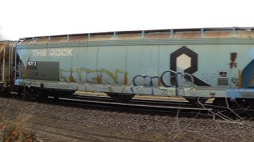 H3 Dash 9 with open door leads BNSF mixed freight train