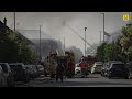 HUGE plumes of smoke as firefighters battle a blaze at supermarket in Golders Green