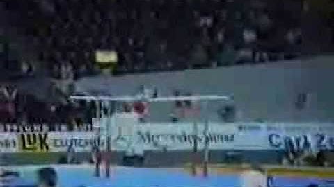 Parallel bars. Roll back and cut straddled to support