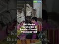 TMC worker found under a bundle of sarees Video goes viral