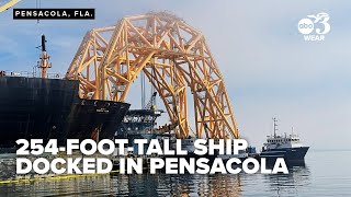 What is the 254-foot-tall ship docked in Pensacola?