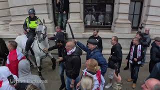 The Moment A Man Swings An Umbrella At A Police Horse During St George’s Day Celebrations In London