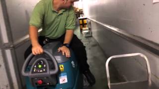 Publix guy riding floor machine