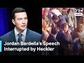 Heckler Disrupts Bardella’s Rally as French Far-Right Leader Calls for National Anthem | AC1N