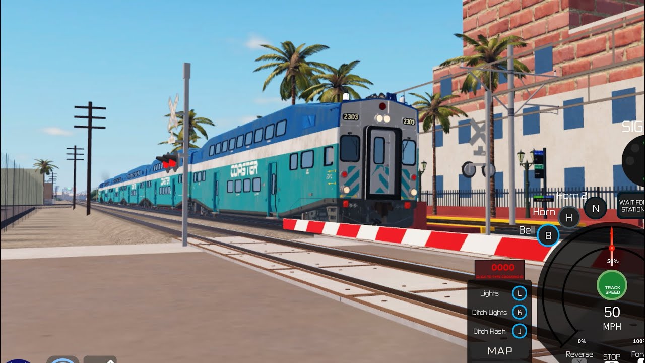 Coaster cab car 2303 flies past Washington street with (3002 or 3001 I think) (June 22nd 2016)