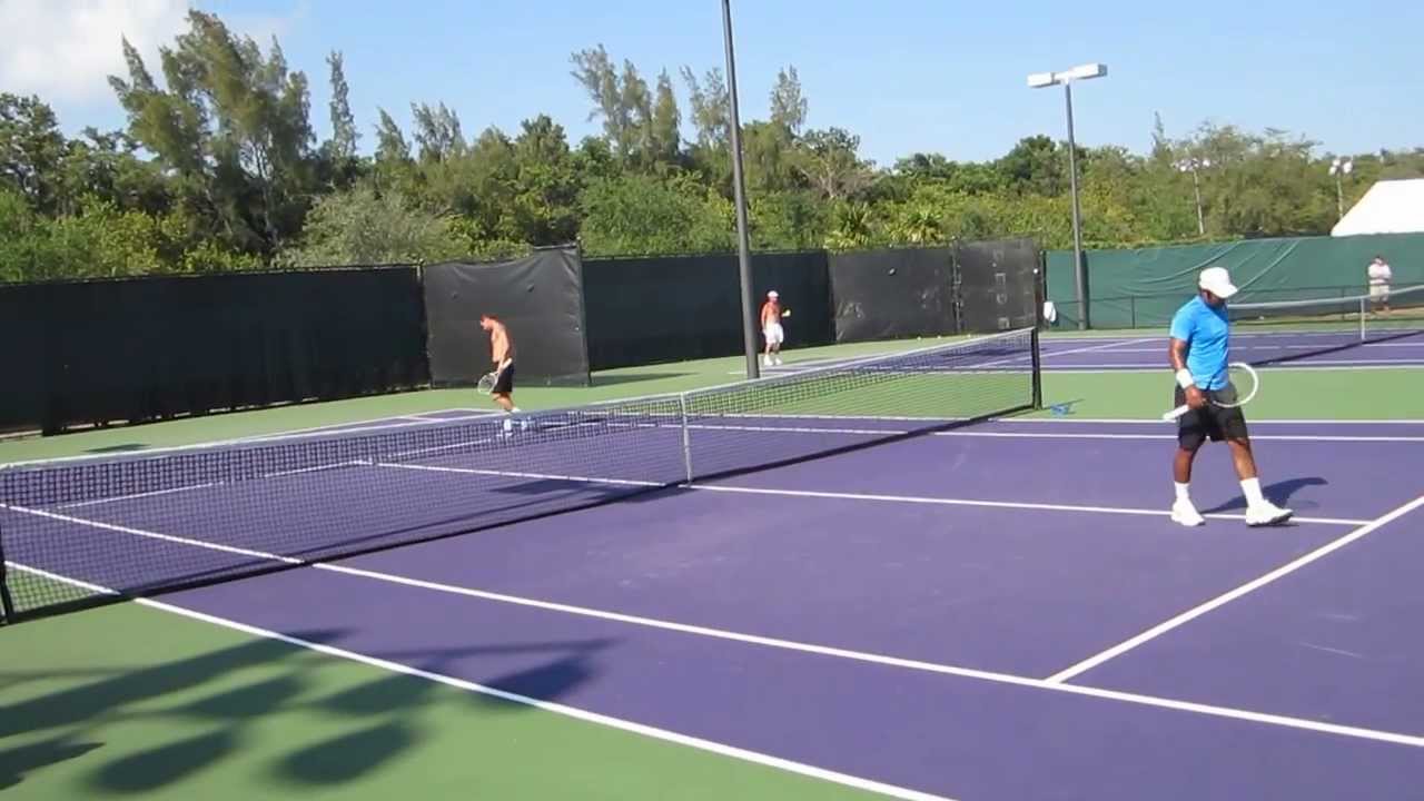 Paes practicing volleys with Llodra - YouTube