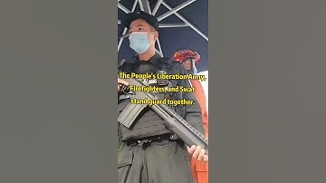 Thumbnail of The People's Liberation Army, Firefighters, and Swat stand guard together.