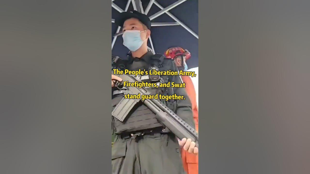 The People's Liberation Army, Firefighters, and Swat stand guard together.