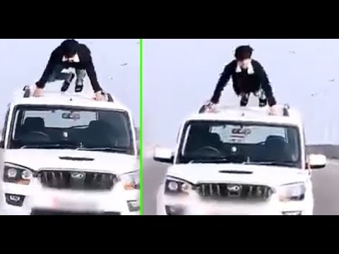 Watch: Man does push-ups on roof of moving car, UP Police 'rewards' him ...