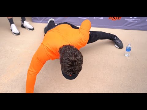 OSU's Mike Gundy demonstrates one-handed pushups during media session