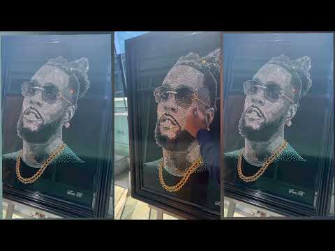 Burna Boy Receives A Painting Made With 15,000 Crystals Of Gold And Black Diamond