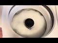 Trying a high sudsing detergent in an HE machine.