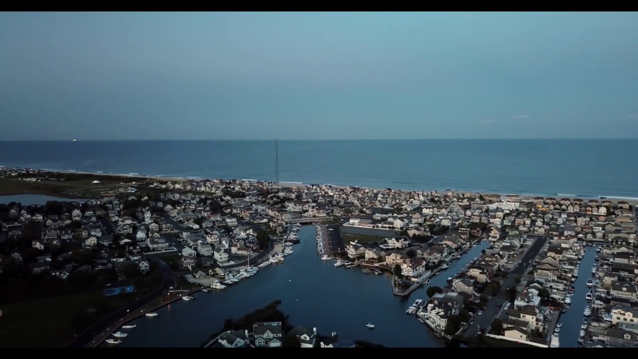 Manasquan NJ Glimmer Glass At Sunset - Drone Footage