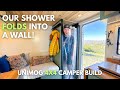 Our shower collapses into a wall convertible shower with 3 solid walls trelino toilet  unimog 23