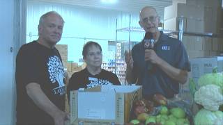 Justin speaks with the leaders of the Lakeland Pantry